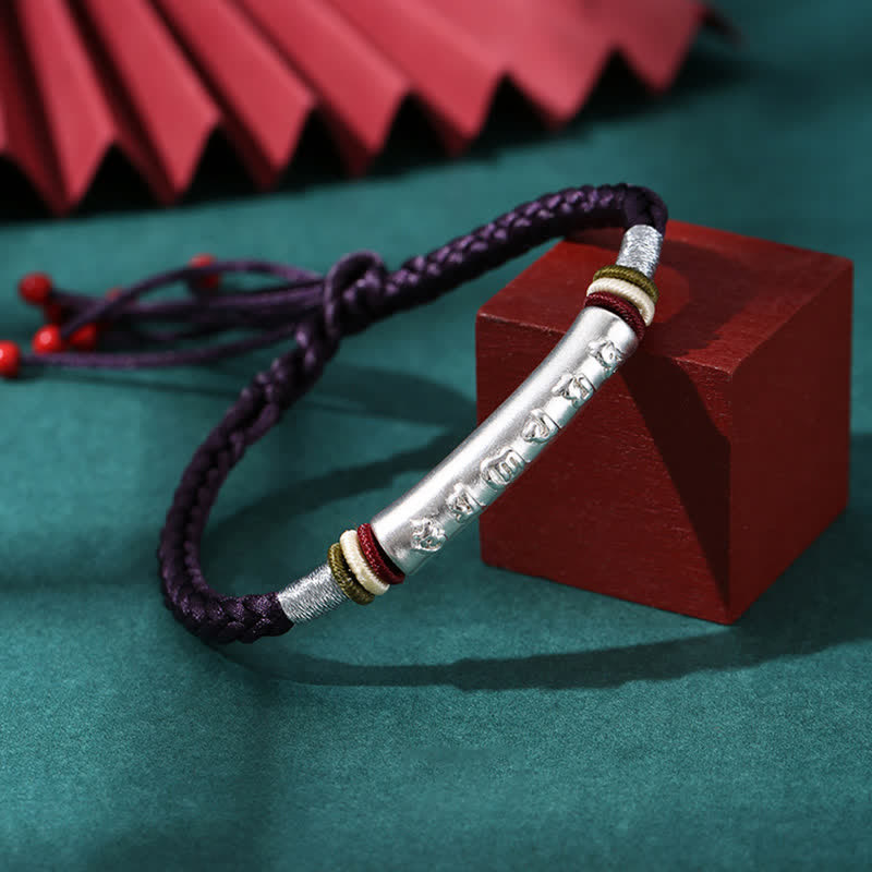 Om Mani Padme Hum Red String Bracelet – Purple cord variant with silver mantra bar on display