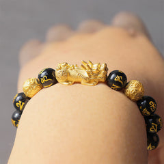 Obsidian PiXiu Bracelet – On female wrist from above gold PiXiu centered, feng shui good luck bracelet
