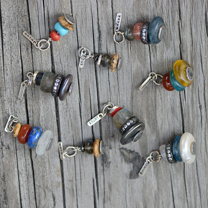 Zen Cairn Crystal Pendant – eight beaded charm pendants with metal tags on weathered wood, stone pendant collection