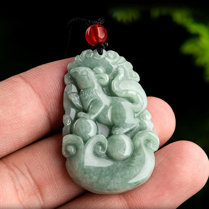 Green Jade Zodiac Necklace - Goat zodiac jade held in hand showing carved relief, cultural jewelry