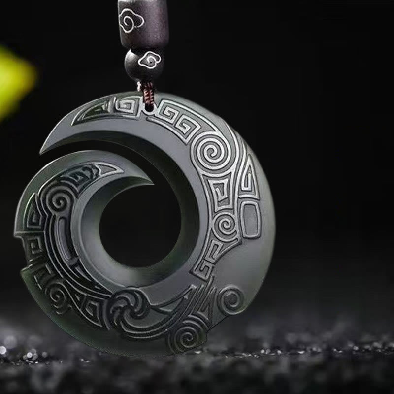 Hetian Cyan Jade Peace Buckle Luck Necklace – Close-up of dark charcoal-green jade pendant with Greek key and cloud engravings, silver-white detail accents, black cord