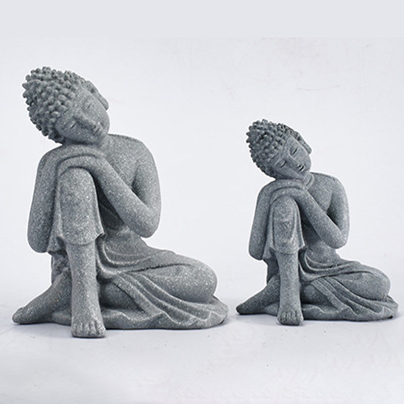 Sitting Meditation Buddha Sandstone Statue – lifestyle altar, wooden surface, warm light, home