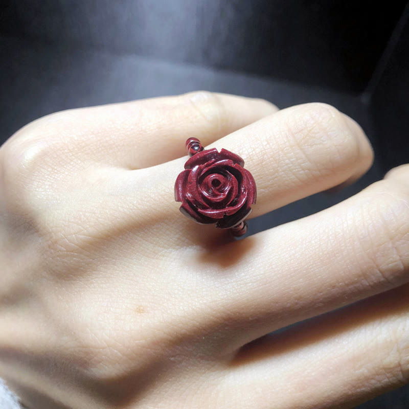 Garnet Cinnabar Ring – finger wearing cinnabar rose ring natural light, everyday protection
