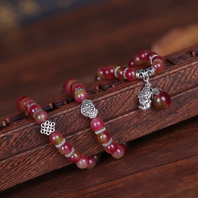 Watermelon Tourmaline Bracelet – On carved wood with endless knot and flower silver charms