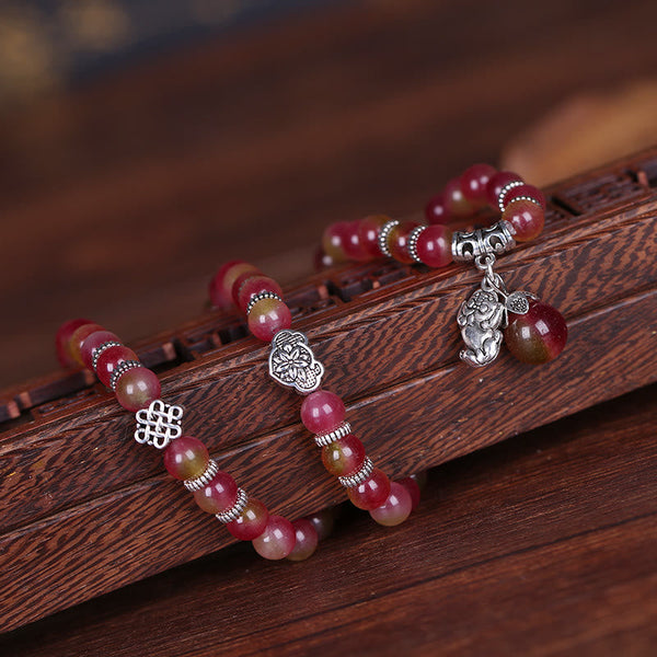 Watermelon Tourmaline Bracelet – On carved wood with endless knot and flower silver charms