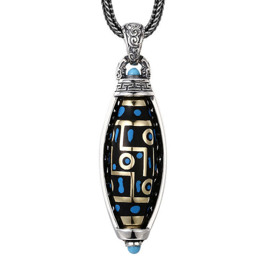 Nine-Eye Dzi Bead Pendant - Straight-on frontal view showing geometric gold pattern on black bead