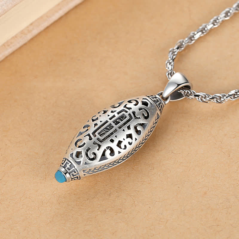 Tibetan Om Mani Padme Hum Pendant Necklace – three-quarter view of filigree barrel with turquoise tip, ethnic pendant