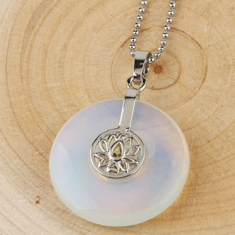 Crystal Amethyst Pink Crystal Lotus Necklace – Opalite lotus donut pendant on ball chain over wood, iridescent milky blue healing crystal