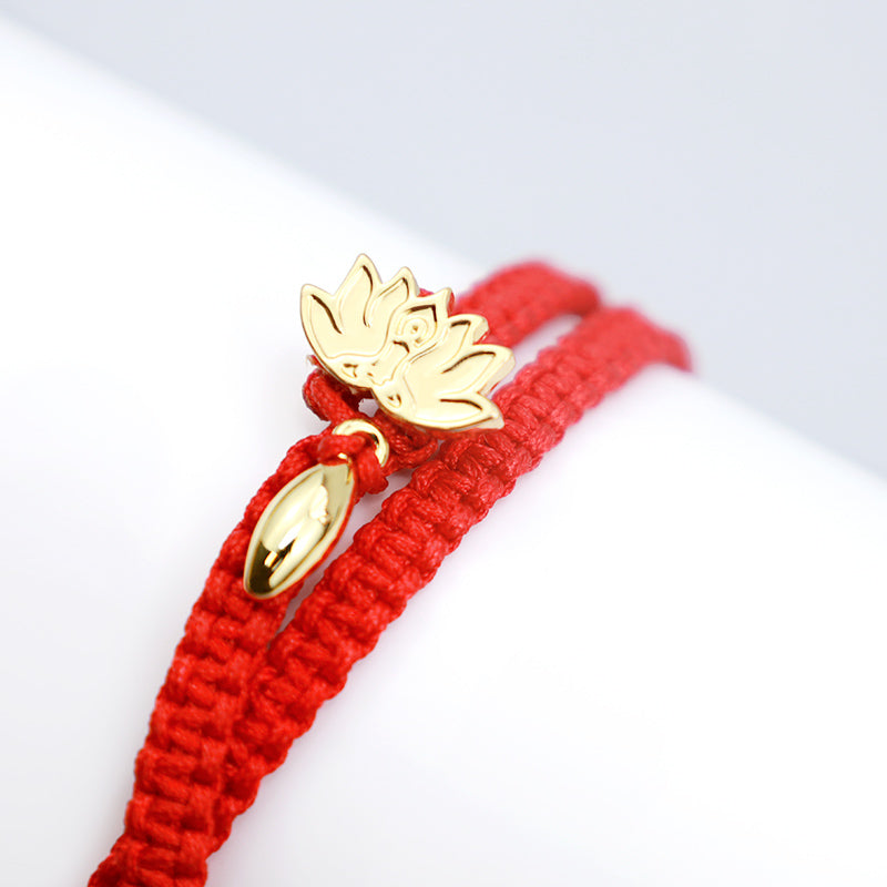 Tibetan Lotus Pink Crystal Red String Bracelet - gold lotus charms on woven red cord, macro detail shot