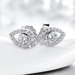 925 Silver Evil Eye Stud Earrings on Glossy White Ceramic Dish, Pavé Crystal Halo Design