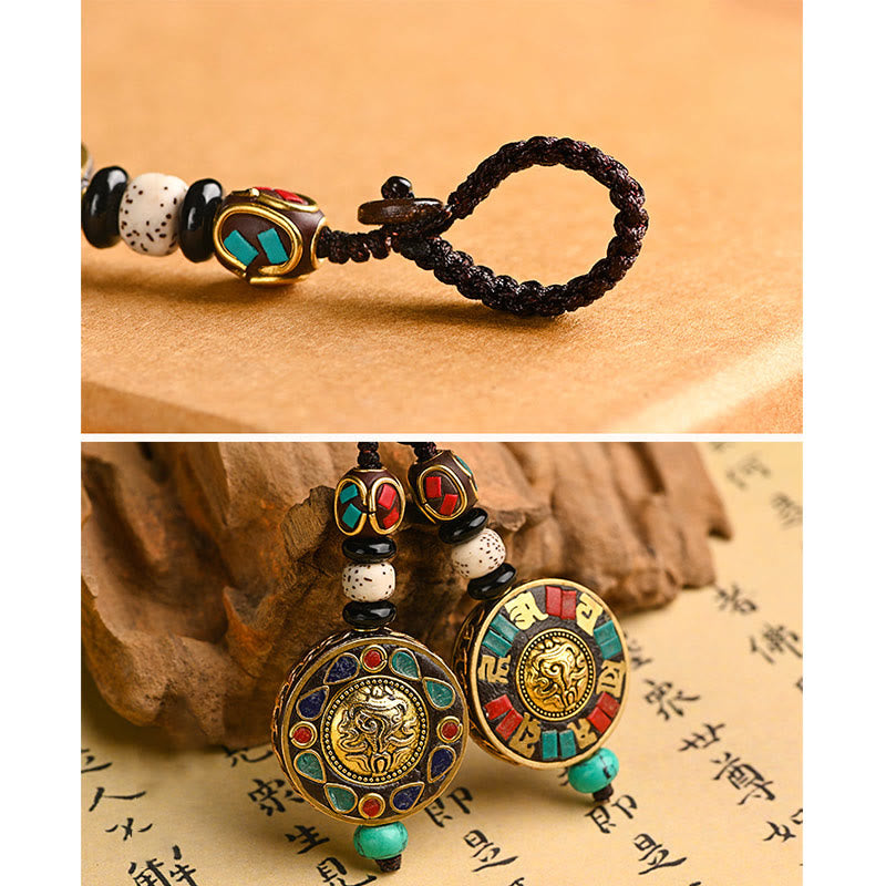 Tibetan Bodhi Seed Peace Key Chain – Ornate medallion with turquoise inlay on cord, dual view, Buddhist charm