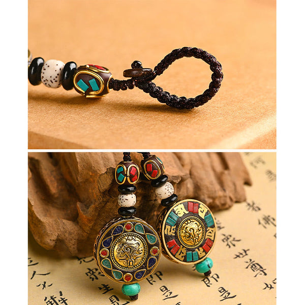 Tibetan Bodhi Seed Peace Key Chain – Ornate medallion with turquoise inlay on cord, dual view, Buddhist charm