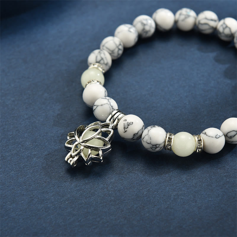 Tibetan Turquoise Glowstone Lotus Bracelet – white howlite with glowing cream center lotus charm close-up, lotus jewelry