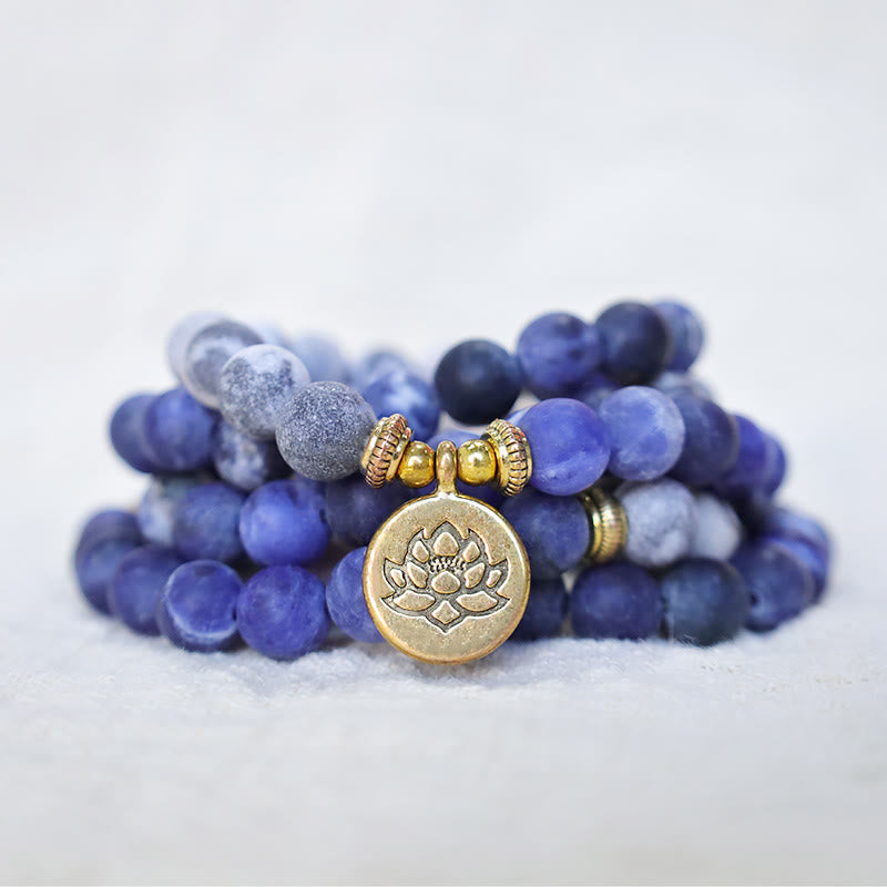 Picasso Jasper Mala – sodalite bracelet with gold lotus charm on white, jasper mala