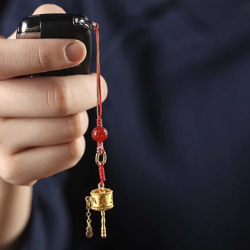 Prayer Wheel Phone Charm – Hanging from car key fob in hand, keychain accessory