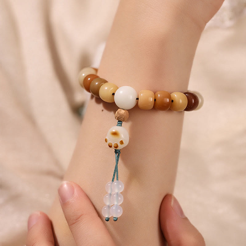 Natural Bodhi Seed Om Mani Padme Hum Wisdom Bracelet - Worn on wrist with cat paw charm