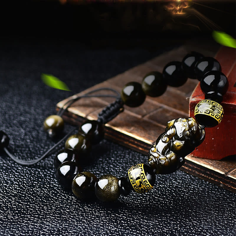 Gold Sheen Obsidian Pixiu Bracelet – Worn on wrist with light sleeve, golden obsidian shine, wrist jewelry