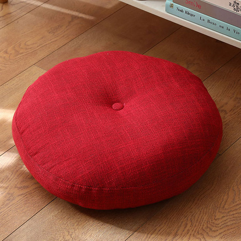 Lotus Linen Meditation Cushion – Deep crimson red tufted on warm oak flooring