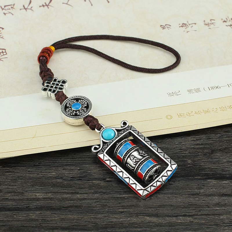 Om Mani Padme Hum Prayer Wheel Keychain – Styled with Chinese calligraphy books, cultural lifestyle shot, Tibetan charm