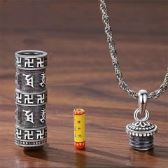 Copper Om Mani Padme Hum Necklace – Disassembled prayer wheel pendant showing interior Surangama Mantra scroll and screw-top lid construction, Tibetan amulet necklace