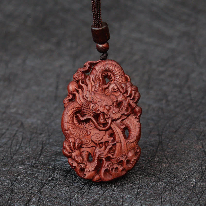 Lightning Jujube Wood Dragon Pendant - Frontal view on dark slate, full dragon motif, Talisman