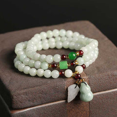 Jade Pixiu Maitreya Buddha Abundance Bracelet – Triple-wrap jade beads on stone box with green red accents, abundance