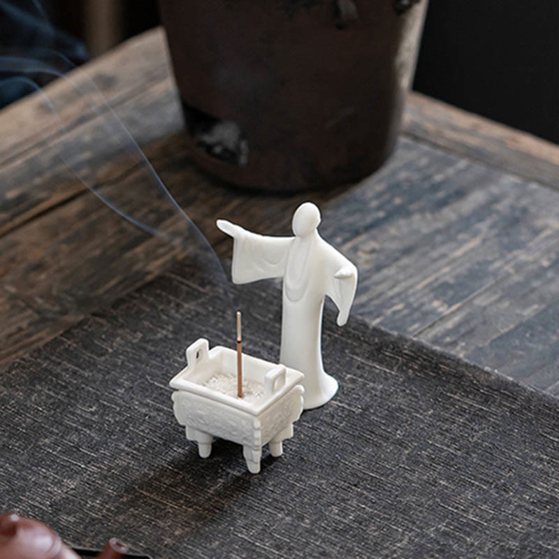 Dragon Ceramic Incense Burner – ding censer with book and tea cup, moody setting, contemplative