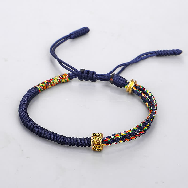 Om Mani Padme Hum Red String Bracelet – Navy blue braided rope with five-color woven pattern and gold mantra bead on white background