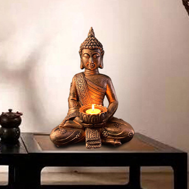 Tibetan Buddha Candlestick - Buddha statue displayed on wooden table with teapot, warm ambient light