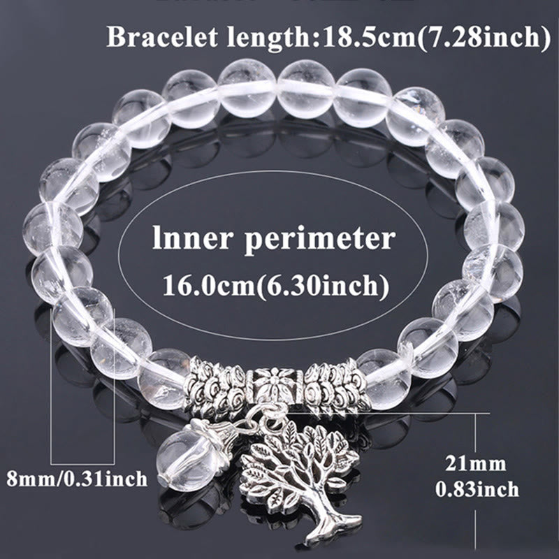Tree of Life clear quartz bracelet with transparent crystal beads and silver tree of life charm, simple elegant design.