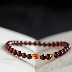 999 Gold Koi Bracelet – 45-degree angle showing koi fish detail, natural garnet, gold koi wealth bracelet