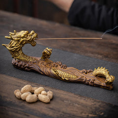 Dragon Protection Incense Burner – low-angle view of golden dragon on rustic wood, incense burning, protective energy