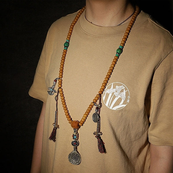 108 Bodhi Seed Mala Bracelet – Mala worn as layered bracelet with amber beads and silver amulet