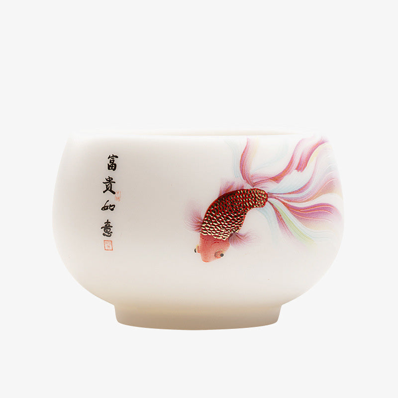 Koi Fish White Ceramic Teacup - angled overhead view showing cup rim and inner koi art