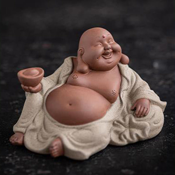 Laughing Buddha Clay Statue – statue beside lucky cat and coins, prosperity corner arrangement