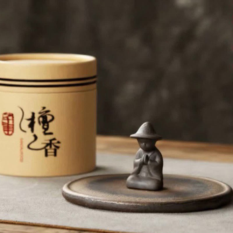 Sandalwood incense set with monk figure and ceramic base, mindful