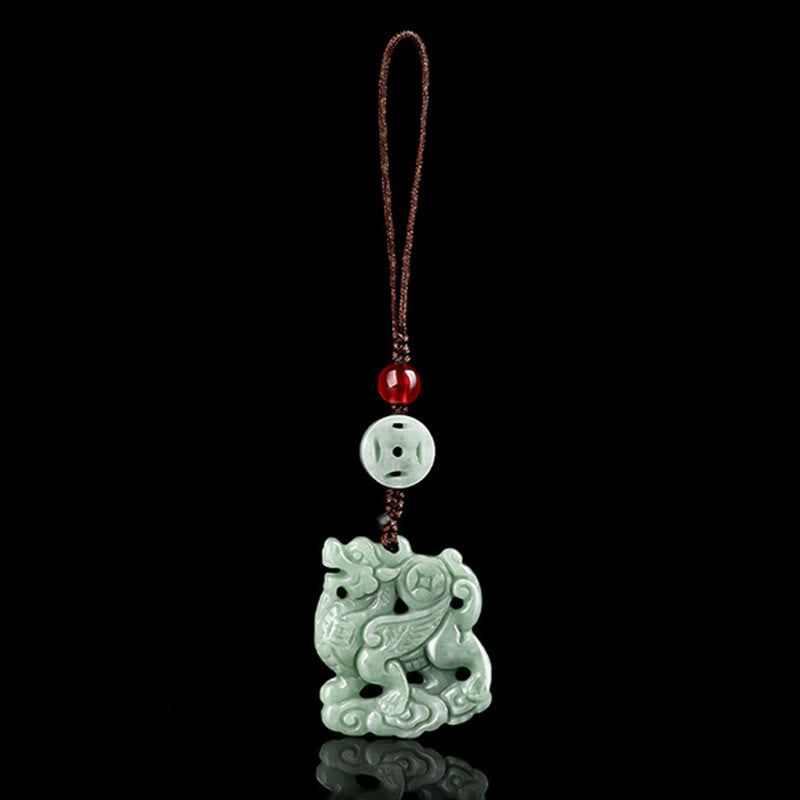 Jade Pixiu Charm – Sage green pixiu pendant with openwork carving on black reflective surface, fortune talisman