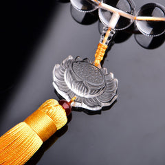 White Crystal Lotus Mala – close-up carved crystal lotus pendant with golden tassel and braided cord, zen decor