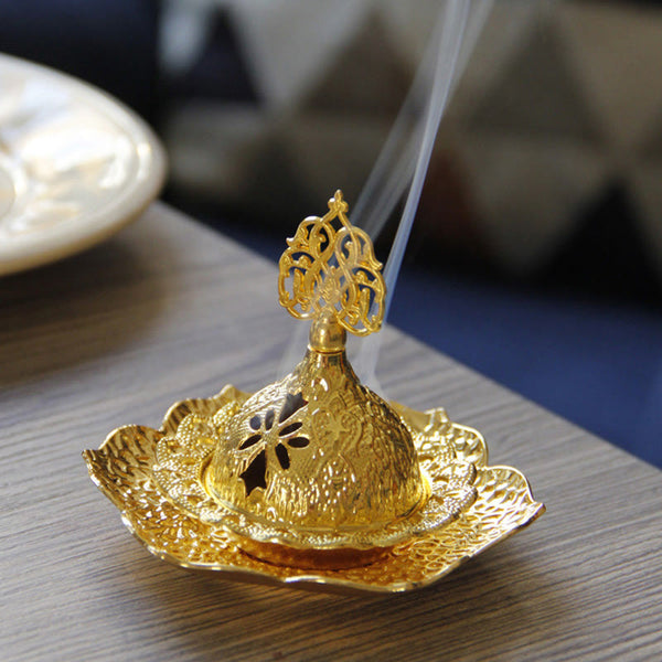Gold Leaf Coaster Incense Burner with dual smoke streams on dark wood, ornate finial, alloy incense burner