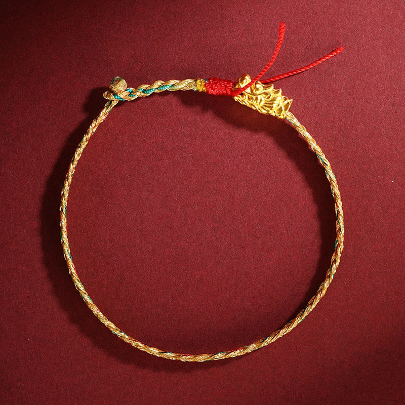 Colorful Dragon Carved Braided Bracelet – Gold dragon head on multicolor braided cord circle, flat lay view, Handcrafted