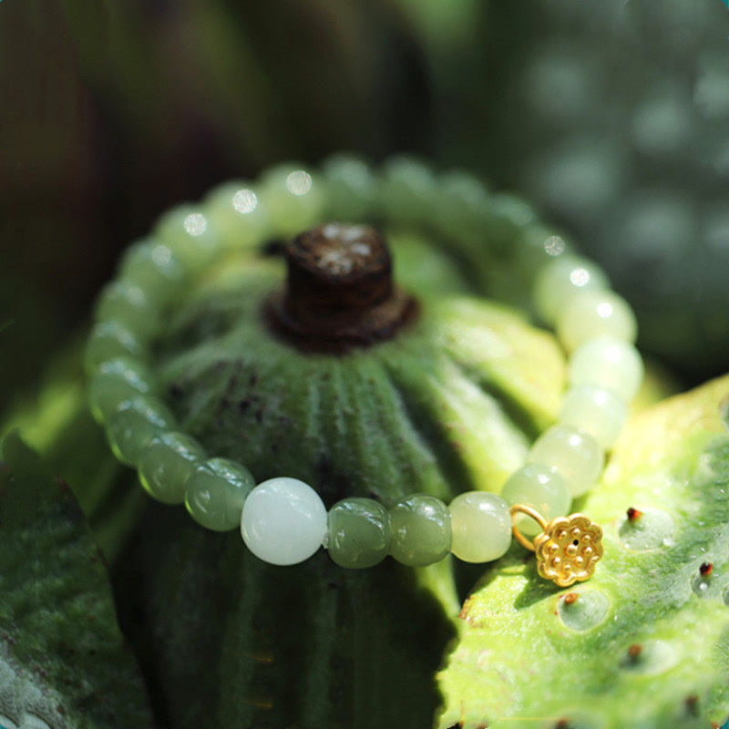 Jade Lotus Abundance Bracelet – Celadon jade beads with gold lotus pod charm on lotus seed pod, jade bracelet