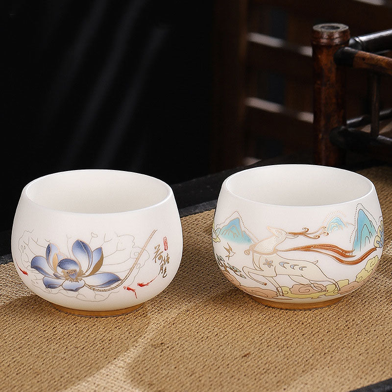 Dragon Cicada Ceramic Tea Bowl - lotus koi and deer landscape pair, gilt-accented porcelain on woven mat