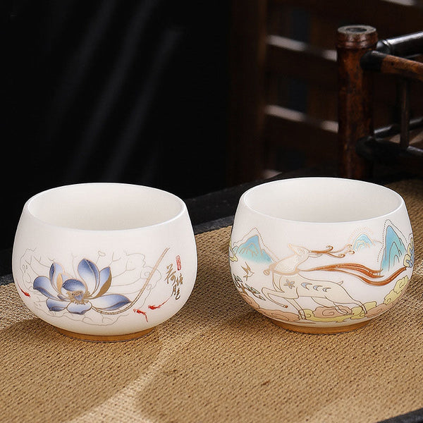 Dragon Cicada Ceramic Tea Bowl - lotus koi and deer landscape pair, gilt-accented porcelain on woven mat