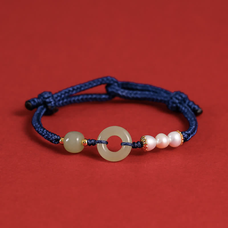 Hetian Jade Pearl Peace Buckle Bracelet – navy cord with jade bi disc and pearl cluster, gold and red enamel accents, red matte shot