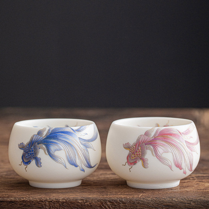Koi Fish Porcelain Tea Cup - comparison shot showing cup next to tea utensils for scale