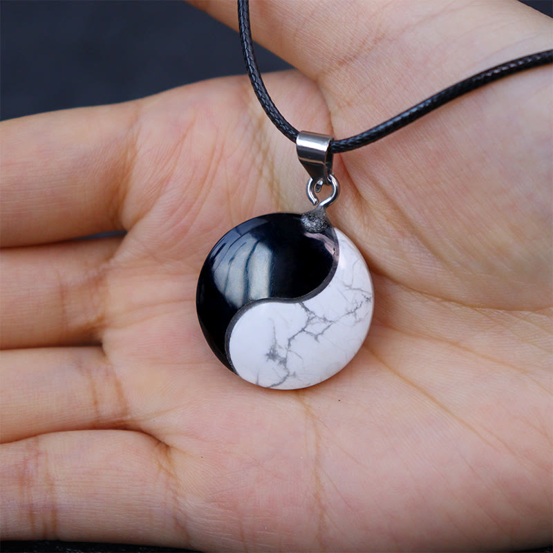 Black Obsidian White Turquoise Yin Yang Transformation Necklace Pendant - Obsidian howlite yin-yang in open palm, spiritual a