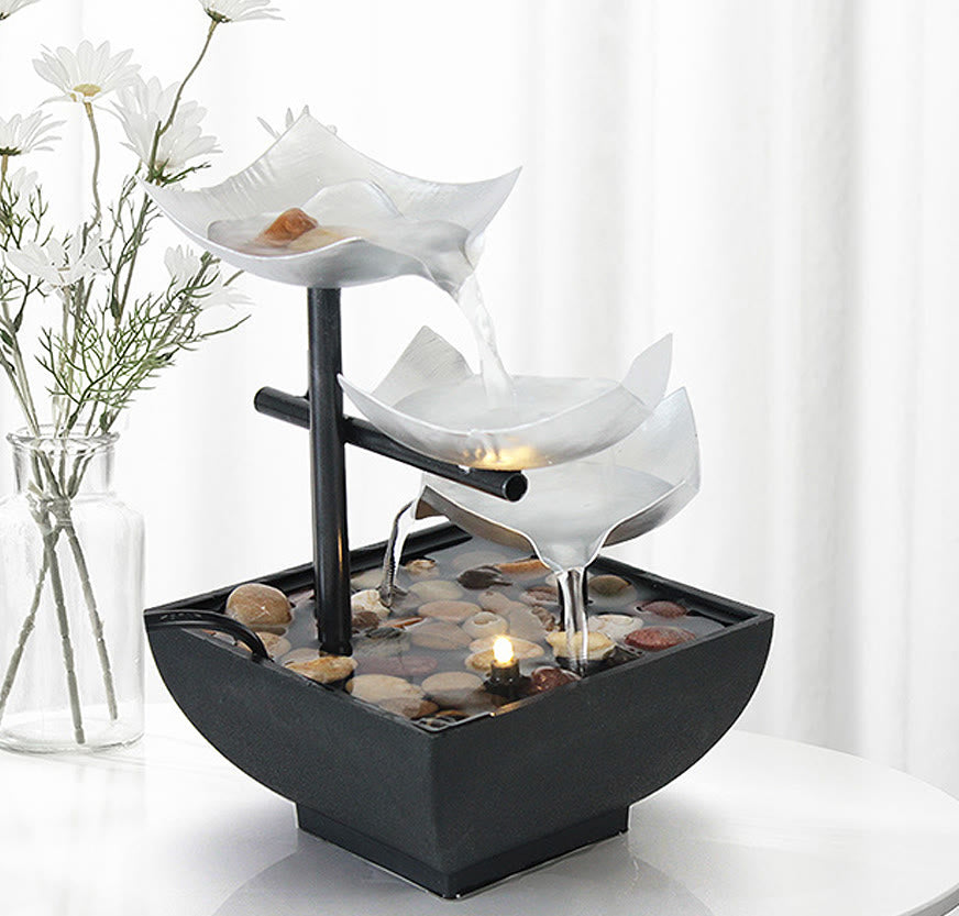 Three Layers Lotus Waterfall Fountain - Frosted lotus tiers with daisies on white table, Tranquil