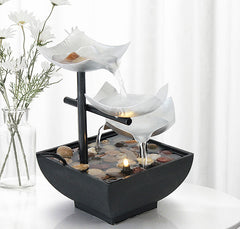 Three Layers Lotus Waterfall Fountain - Frosted lotus tiers with daisies on white table, Tranquil