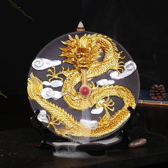 Dragon Backflow Incense Burner in use, golden dragon on black disc, cascading smoke waterfall, zen decor