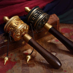 Copper Meditation Prayer Wheel – Pair on rustic wood with fabric, gold and dark variants, healing